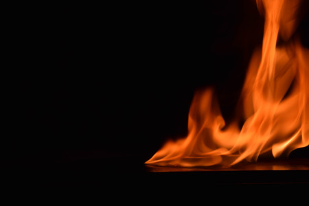 Fire flames on black backgroundの写真素材