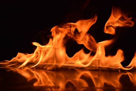 Abstract Fire flames isolated on black backgroundの写真素材
