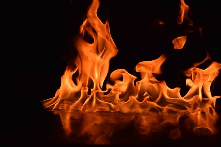 Abstract Fire flames isolated on black backgroundの写真素材