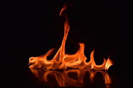 Abstract Fire flames isolated on black backgroundの写真素材
