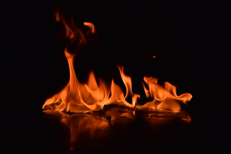 Abstract Fire flames isolated on black backgroundの写真素材