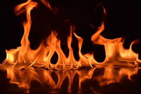 Abstract Fire flames isolated on black backgroundの写真素材