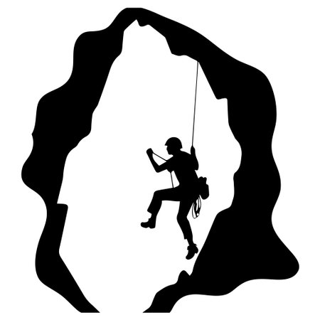 A brave rock climber skillfully navigates a dark cave, showcasing the thrill of adventure and the challenge of exploring rugged terrain.のイラスト素材