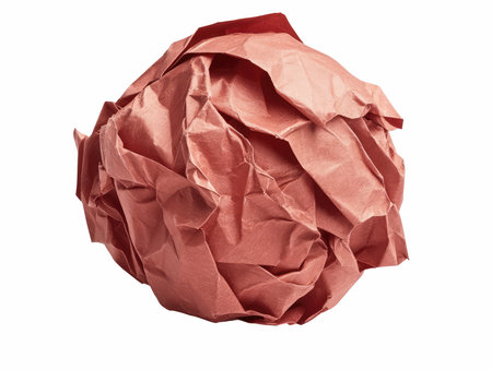 Crumpled red paper ball isolated on white background with clipping pathの写真素材