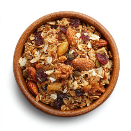 This high-quality image features a bowl of granola isolated on a white background, perfect for promoting healthy snacks, breakfast options, and nutritious meals.の写真素材