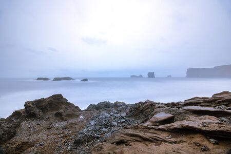 Dyrholaey with ND Filter Effect, rock coast - Icelandの写真素材
