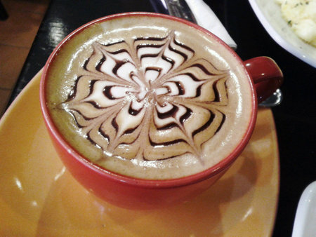 Hot mocha macchiato with beautiful coffee artの素材