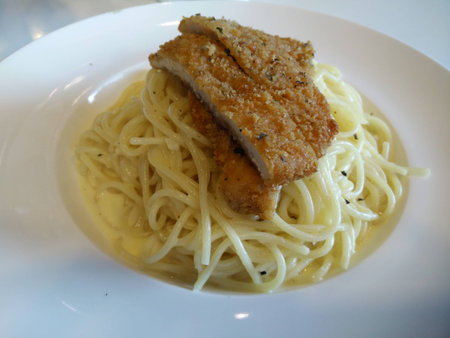 Pasta Carbonara with crispy chickenの写真素材