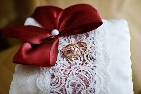 golden wedding rings in a porcelain gift box. wedding ceremonyの写真素材