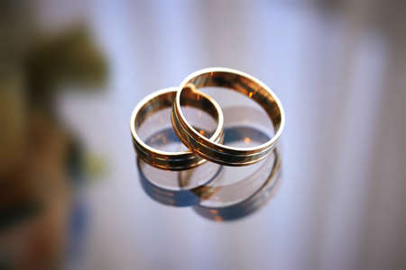 golden wedding rings in a porcelain gift box. wedding ceremonyの写真素材