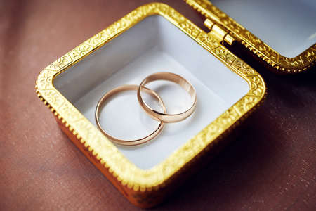 golden wedding rings in a porcelain gift box. wedding ceremonyの写真素材