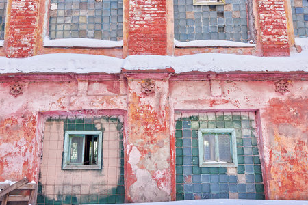 The windows in the old brick wall of an abandoned industrial building.の写真素材