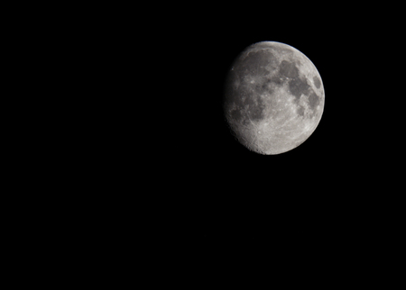 Photo of the Moon in the space on the black background isolated. Suitable for any purpose useの写真素材