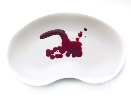 Red blood in the white plastic plate isolated on white background Suitable for any purpose useの写真素材