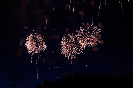 Inexpensive fireworks, over the city, red and blue . For any purpose