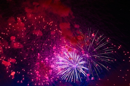 Inexpensive fireworks, over the city, red. For any purposeの写真素材