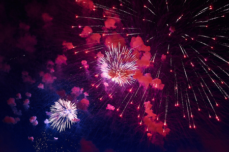 Inexpensive fireworks, over the city, red. For any purposeの写真素材