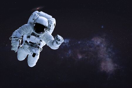Alone single Astronaut in outer . Science fiction wallpaper. Elements of this image were furnished...