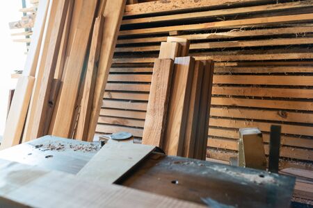 Working woodworking machine with secure covered plane. Selective focus. Manual wood processing concept.の写真素材