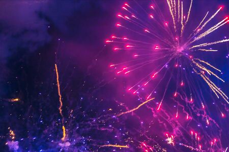 Inexpensive fireworks, over the city, red and blue. Motion blur. Light flares. For any purpose