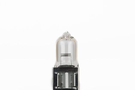 Automotive halogen headlight bulb closeup isolated on white