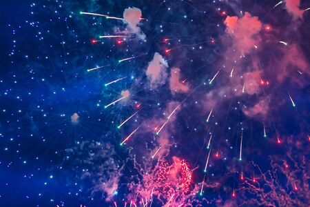 Inexpensive fireworks, over the city, red and blue. For any purposeの写真素材