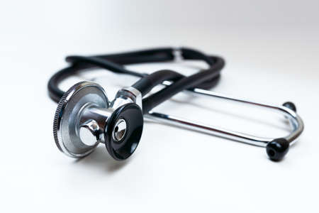 Black Stethoscope and phonendoscope isolated on white close up. Selective focus. Medical concept.の写真素材