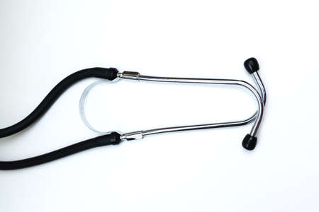 Black Stethoscope and phonendoscope isolated on white with copy space. Selective focus. Medical concept.の写真素材