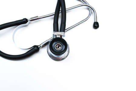 Black Stethoscope phonendoscope isolated on white background with copy space in center. Selective focus. Medical concept.の写真素材