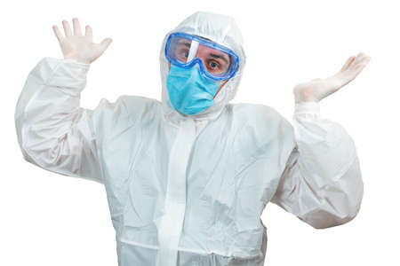 Surprised Male doctor with hands up wearing white protective suit and mask isolated on white...
