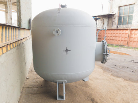 Air receiver for various media close up, used as a storage tank for compressed gas or liquid under pressure, and as a buffer capacity for smoothing out pressure fluctuations in gas on industrial plants and factories.の写真素材