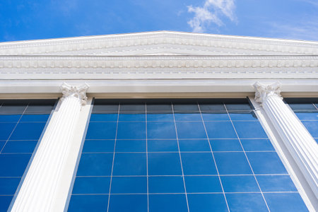 Glass Tower with a Stunning Blue FaÃ§ade and White Clouds in the Sky