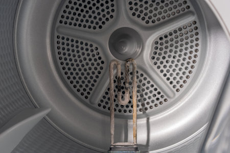 Close-Up of a Corroded Heating Element Inside a Dryer with Visible Limescale Depositsの写真素材