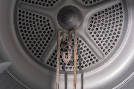 Inside the Washing Machine: Corroded Heating Element and the Unseen Effects of Limescaleの写真素材