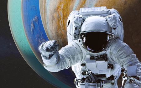 Space astronaut in a white spacesuit floating in space during a spacewalk, in front of turquoise,...