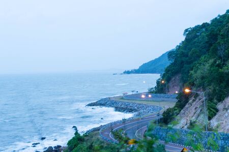 Street along the beach and mountainの写真素材