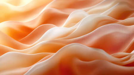 Flowing peach and orange silk fabric waves creating abstract backgroundの写真素材