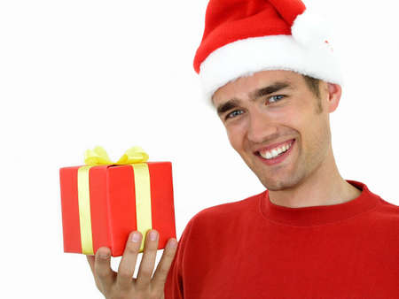 Man wearing a Christmas hat holding present