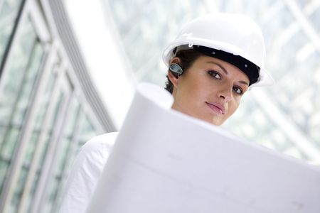 Female architect holding blueprints