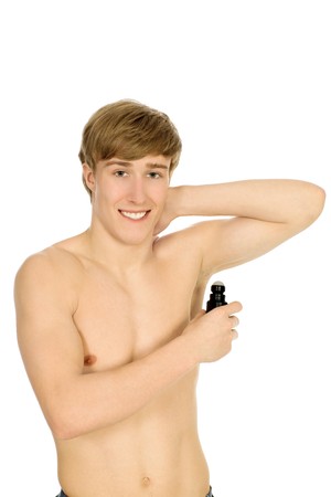 Young man applying deodorant の写真素材