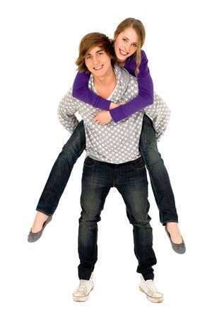 Guy giving girlfriend a piggyback rideの写真素材