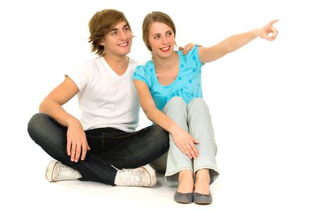 Teenage couple pointingの写真素材