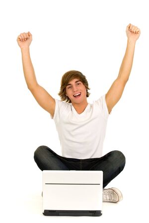 Casual guy sitting with laptopの写真素材