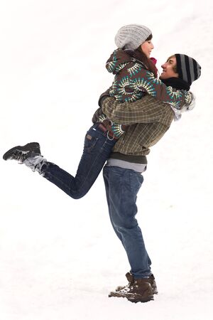 Couple playing in snowの写真素材