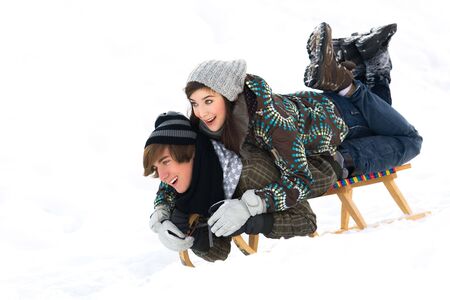 Young couple sledding