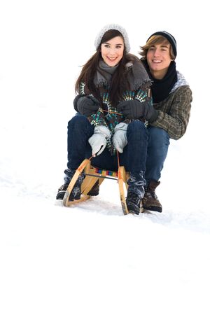 Young couple sleddingの写真素材