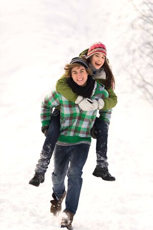 Man giving woman piggybackの写真素材