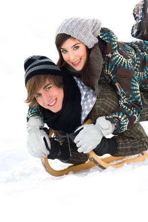 Young couple sleddingの写真素材