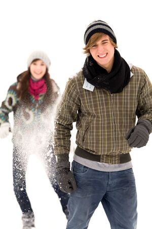 Couple having snowball fightの写真素材