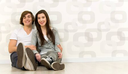 Couple sitting on the floorの写真素材